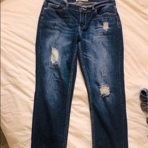 Distressed med to dark denim jeans